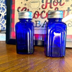 Blue glass salt shakers. Vintage